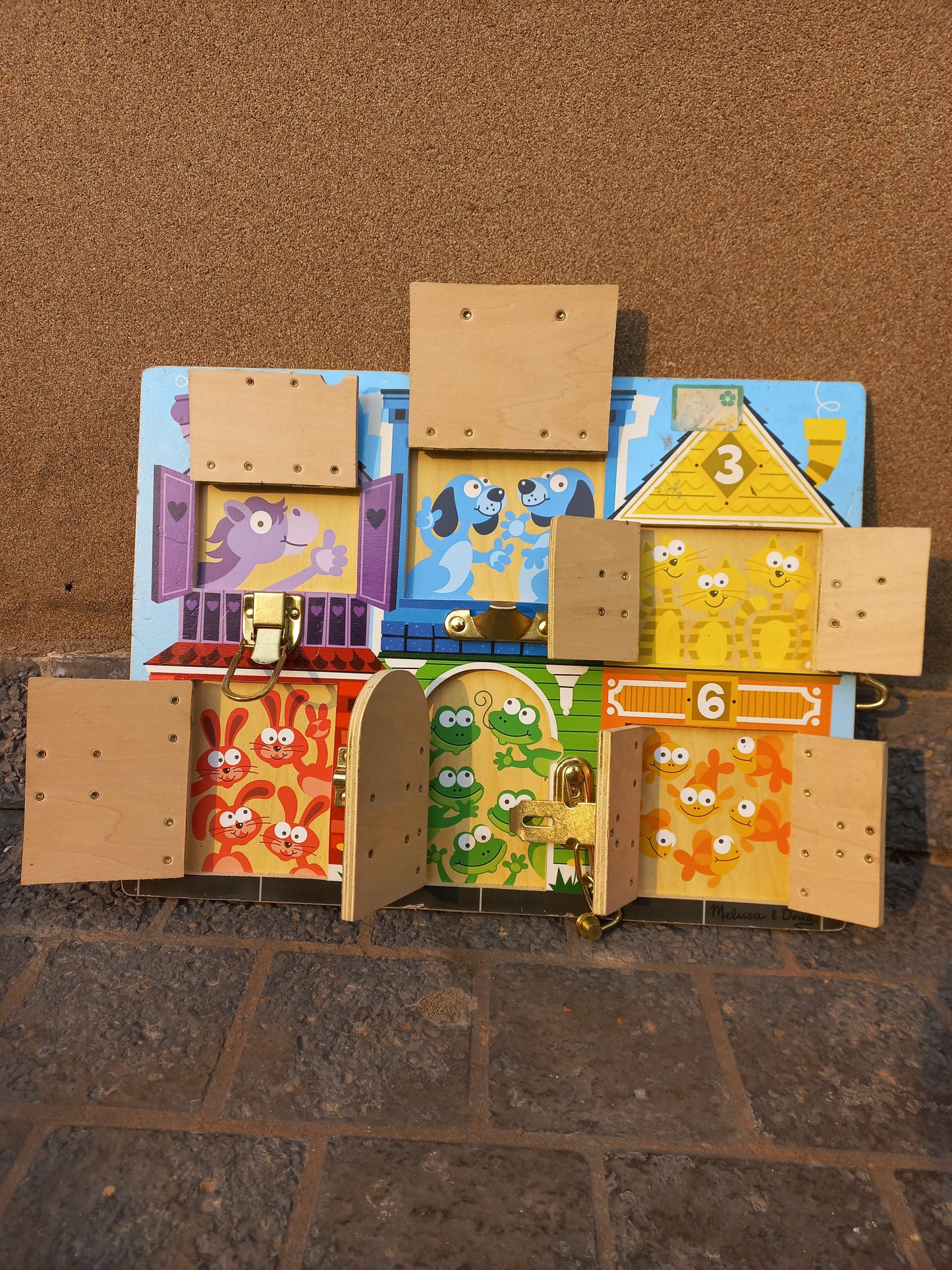 Melissa & Doug latches board